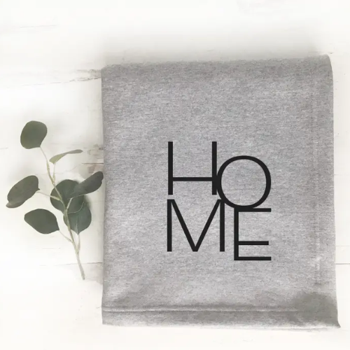 Made from super comfy sweatshirt material, it is the best way to snuggle up!
Product details:
Machine washable.
50% cotton, 50% polyester.
Double-needle hem.
Mitered V corners.
Hemmed sides all around.
Dimensions: 60" x 50".
Screen Print in Black on Athletic Grey blankets