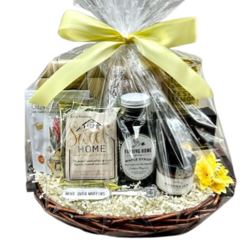 Welcome to Your New Home. Make it a great morning with this Home Sweet Home gift basket. Featuring Buttermilk Pancake Mix, Maple Syrup, Banana Jam with a and a vintage silver spreader with saying, a Perfect Pot of Coffee, Ginger Chews, Almond Biscotti, Zesty Lemon Wafers, and Chocolate Covered Coffee Beans. Your gift will be wrapped in a clear cello with a festive tie bow.