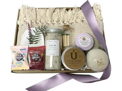 Lavender is ideal for soothing away the stresses of the day and promoting sleep.  Your gift will include a 50″ x 60″ Cotton Throw Blanket to cozy up on the couch with assorted Tea Drops, an unwind candle with matches. Enjoy a  therapeutic shower with an artisan made lavender Shower Steamer. Relax your body and mind with Calming Lavender bath salts, a bath bomb, with a silky soft sea sponge. Your gift will be wrapped in clear cello with a coordinating tie bow.