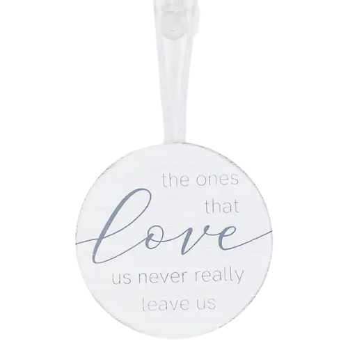 This wooden ornament/wall hanging as a sweet reminder! Fits perfectly in the front of a gift basket or hanging under the tie bow. It comes with a neutral combination of white and grey colors and features a cute round shape. Displaying "The Ones That Love Us Never Really Leave Us"