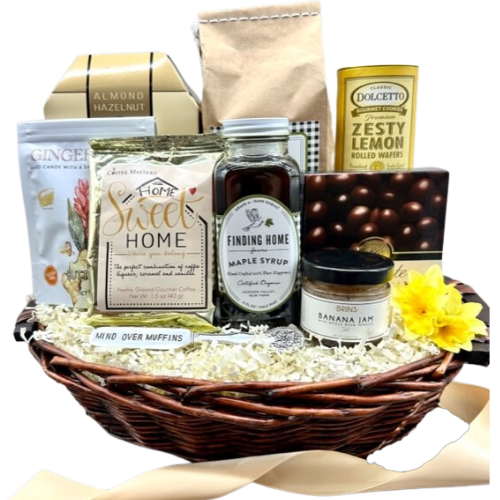 Welcome to Your New Home.  Make it a great morning with this Home Sweet Home gift basket.  Featuring Buttermilk Pancake Mix, Maple Syrup, Banana Jam with a and a vintage silver spreader with saying, a Perfect Pot of Coffee, Ginger Chews, Almond Biscotti, Zesty Lemon Wafers, and Chocolate Covered Coffee Beans.  Your gift will be wrapped in a clear cello with a festive tie bow.