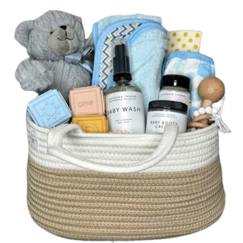 Help the new parents keep organized with this Rope Diaper Caddy Organizer. Your gift filled with hooded terry cloth towel set, organic washcloth, Organic raw shea butter baby booty cream, baby wash and sweet cheeks body powder, silicon and beech wood rattle, block set and plush teddy bear.