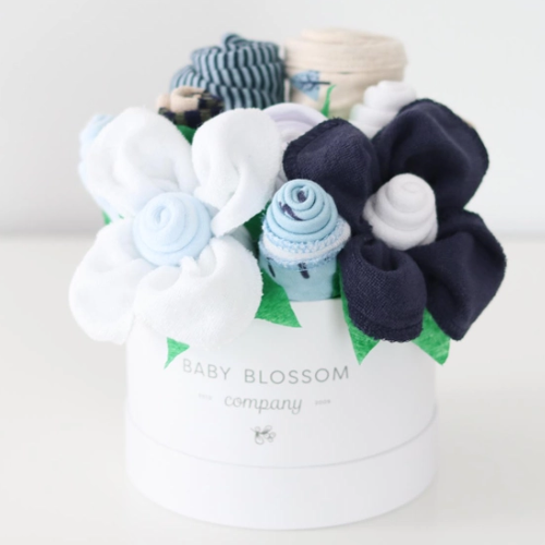 Celebrate the new mom or mom-to-be in the best way possible with flowers that are practical and oh-so-adorable. The blooms: 1 bodysuit 1 bib 1 burp cloth 3 washcloths 3 pairs of socks, Sized 0-3months. Available in 3 unique collections - Neutral Baby Animals, Pink Ballerina, Blue Fox