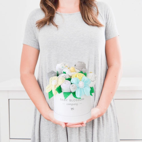 Celebrate the new mom or mom-to-be in the best way possible with flowers that are practical and oh-so-adorable. The blooms: 1 bodysuit 1 bib 1 burp cloth 3 washcloths 3 pairs of socks, Sized 0-3months. Available in 3 unique collections - Neutral Baby Animals, Pink Ballerina, Blue Fox