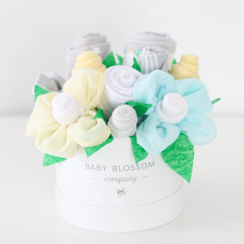 Celebrate the new mom or mom-to-be in the best way possible with flowers that are practical and oh-so-adorable.  The blooms: 1 bodysuit 1 bib 1 burp cloth 3 washcloths 3 pairs of socks, Sized 0-3months. Available in 3 unique collections - Neutral Baby Animals, Pink Ballerina, Blue Fox
