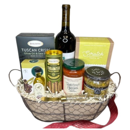 Enjoy an Italian pasta night.  This gift basket includes everything you need to enjoy a dinner in, a bottle of red wine, handcrafted pasta, olive oil & sea salt crackers, olive biscuits, Mediterranean bruschetta with spreader, Stonewall Kitchen pasta sauce, Olive Oil, and rich tiramisu wafers for dessert. Your gift will be wrapped in a clear cello with a festive tie bow.