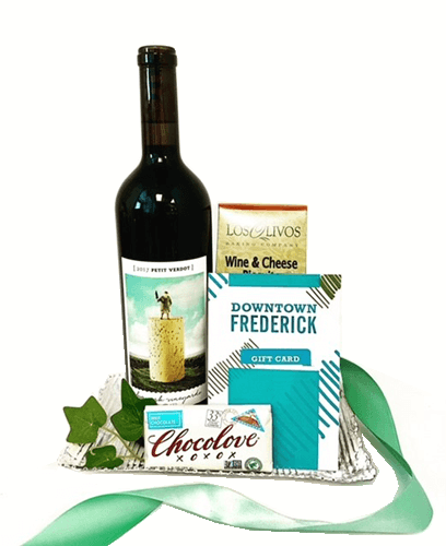 We ChocoLOVE Big Cork Vineyard.  Paired with a Downtown Frederick Gift Card, wine and cheese crackers and a dark chocolate bar created on a reusable galvanized tin tray.  A perfect gift to send to a new homeowner, a thank you or a client referral gift.  Your gift includes a bottle of Big Cork Petite Verdot, select your Downtown Frederick Gift Card Amount below. Your gift will be wrapped in a clear cello with a coordinating tie bow.